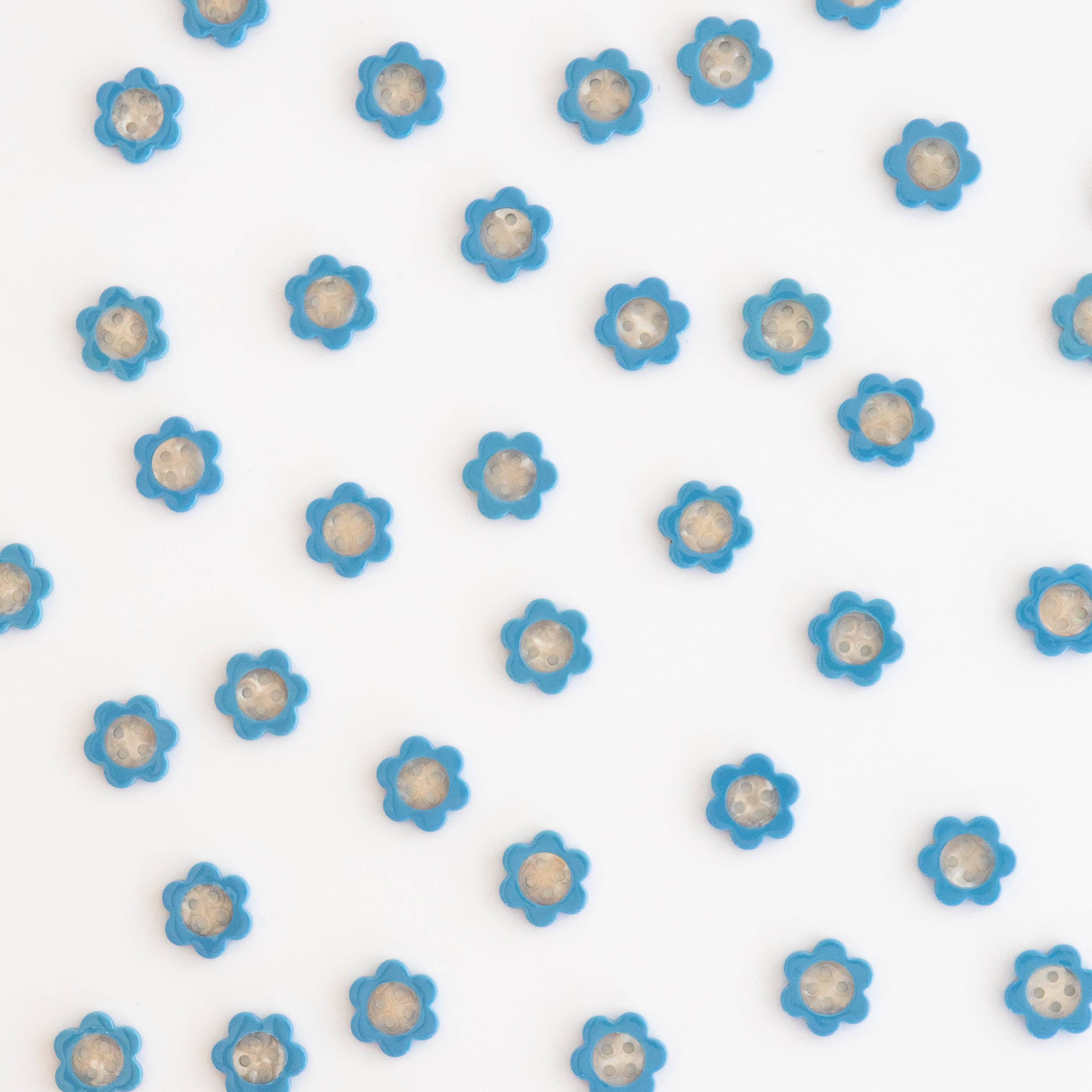 Petits boutons marguerite bleue 15 mm