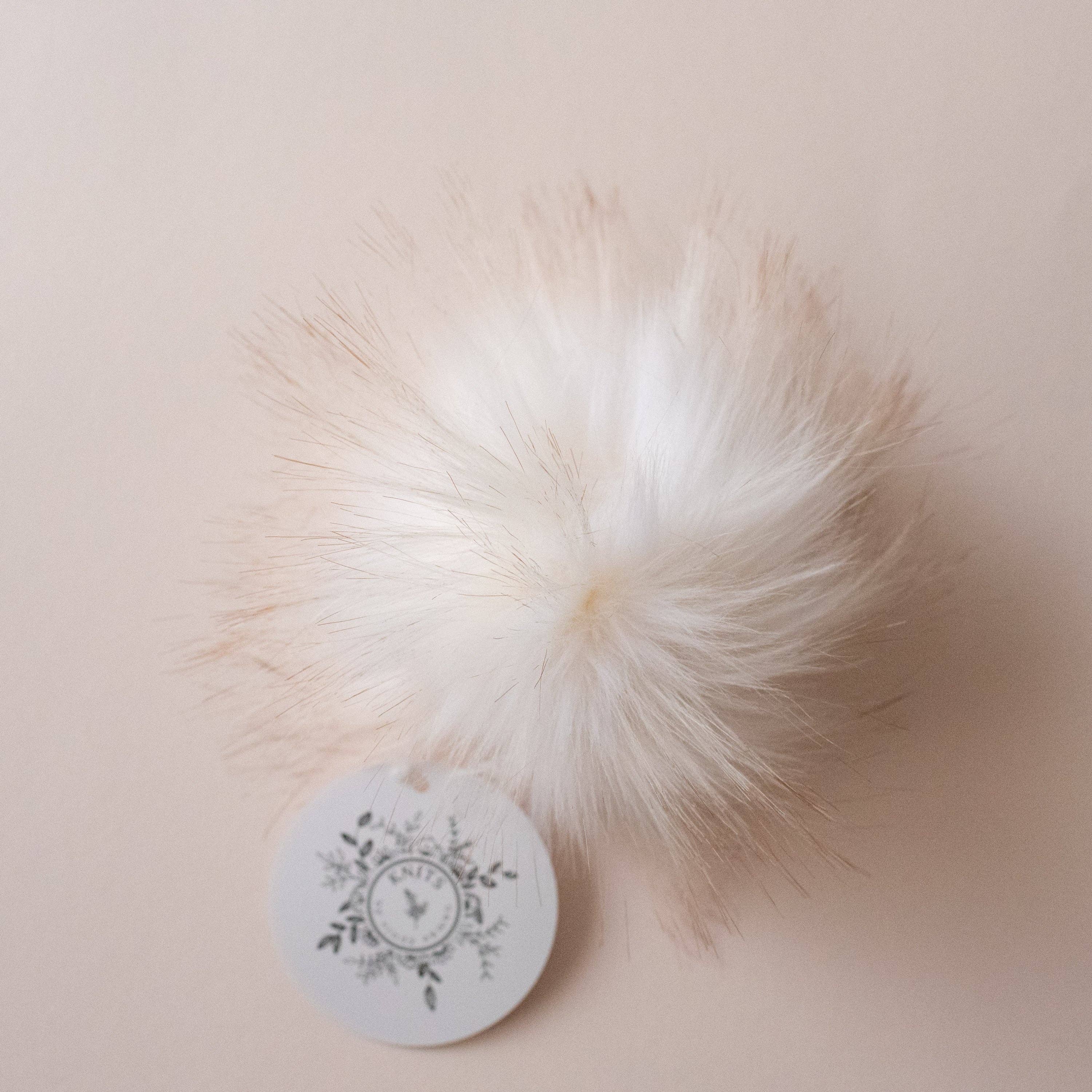 Pompon en fausse fourrure