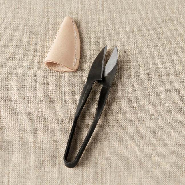Coupe fil avec capuchon en cuir